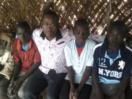 Simon Ateba and some children at the Minawao Camp