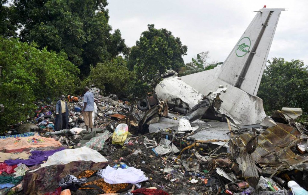 Responders pick through the wreckage of a cargo plane which crashed in the capital Juba, South Sudan Wednesday, Nov. 4, 2015. The cargo plane was taking off from the South Sudanese capital of Juba when it crashed along the banks of the Nile River, killing dozens according to witnesses and the government. (AP Photo/Jason Patinkin)