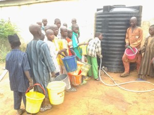 Almajiri pupils queuing for water in Sokotoe school