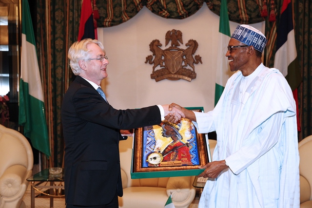 President Buhari presents the outgoing Ambassador with a gift
