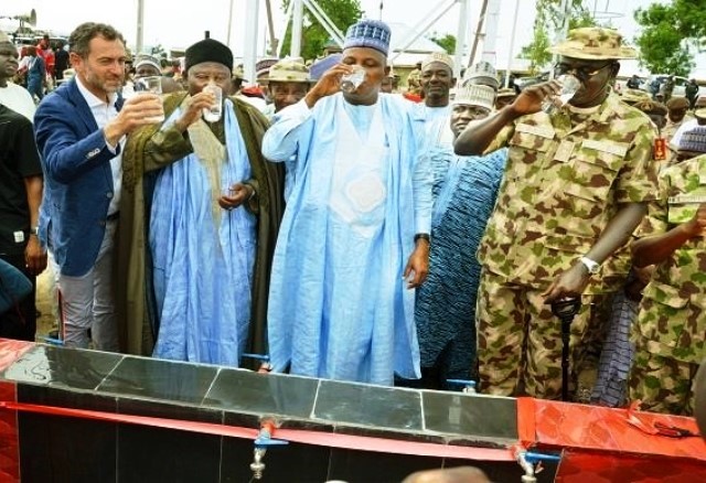 Toby Lanzer (far left) pictured with Governor Kashim Shettima and the Chief of Army Staff, Tukur Buratai, during the commissioning of a bore hole for the IDPs