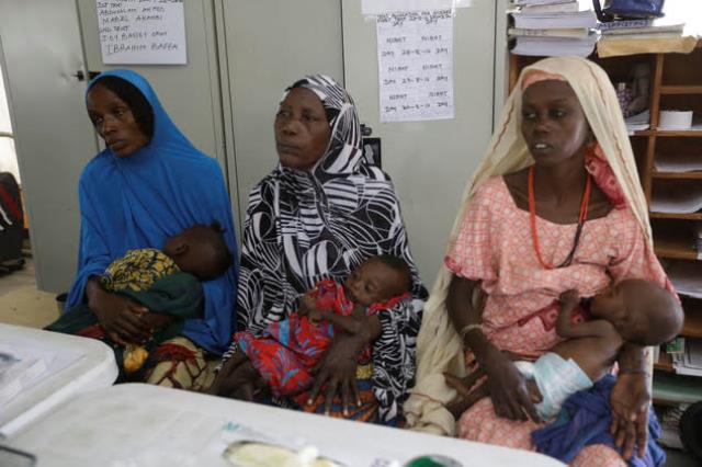 Mothers with their malnourished children wait for treatment at a clinic runs by Doctors Without Borders in Maiduguri, Nigeria, Monday Aug. 29, 2016. Children who escaped Boko Haram's Islamic insurgency now are dying of starvation in refugee camps in the biggest city in northeast Nigeria because officials are stealing food aid, workers say. (AP Photo/Sunday Alamba)