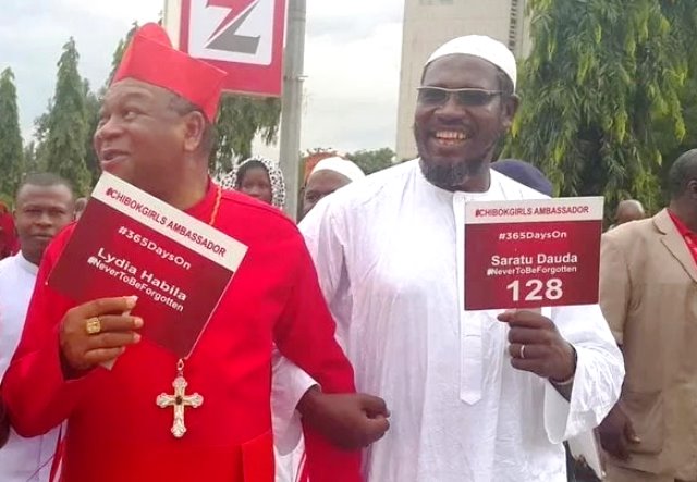 File: John Onaiyekan, Catholic cardinal and Ustaz Muhammad, Muslim Imam, march in solidarity with the Bring back our Girls group in Abuja