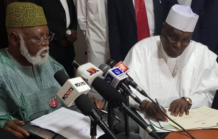 Atiku signs peace accord, asks Buhari to sign Electoral Act