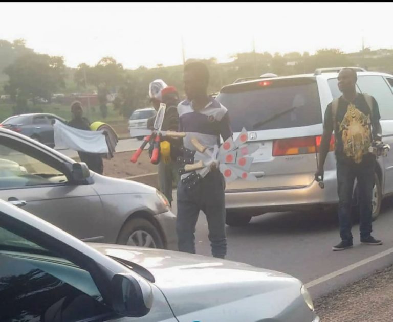 Abuja residents, motorists panic over hawking of sharp cutlasses in traffic
