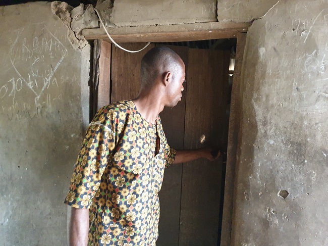 Saheed Adebisi, a cocoa farmer shows one of the burgled rooms when the herders allegedly attacked his community. Photo Credit: Olugbenga Adanikin, The ICIR