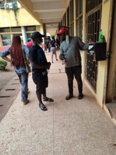 Ogenyi and Agu holding conversation on how much they each paid for their passports