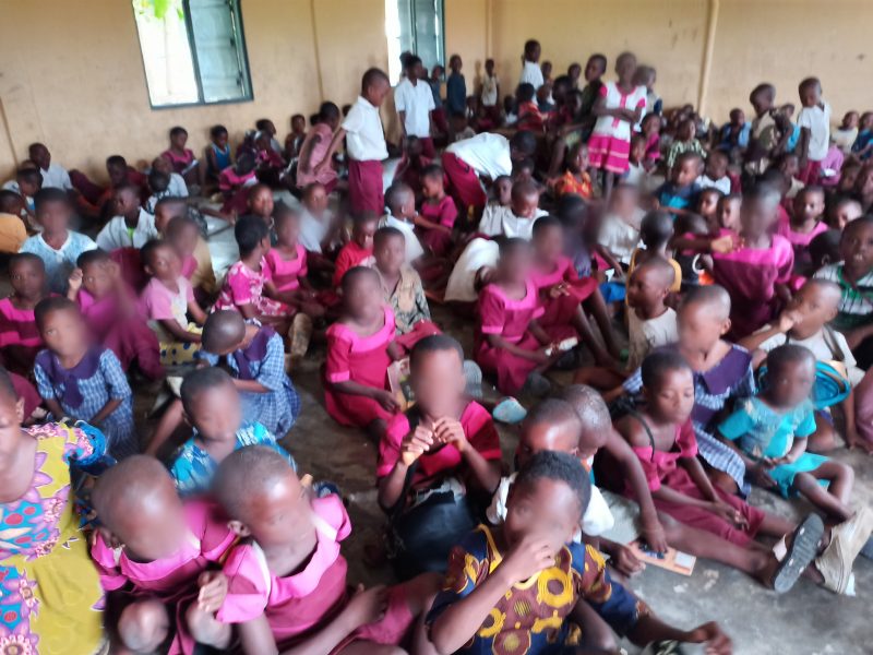 Pupils of St Paul African Church School, Ibaka, Mbo LGA sitting on empty floor during classes. Credit: Ekemini Simon.