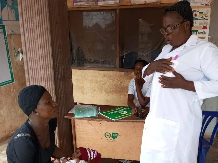 OIC, Amansea PHC Eunice Obi educatina a nursing mother on exclusive breastfeeding
