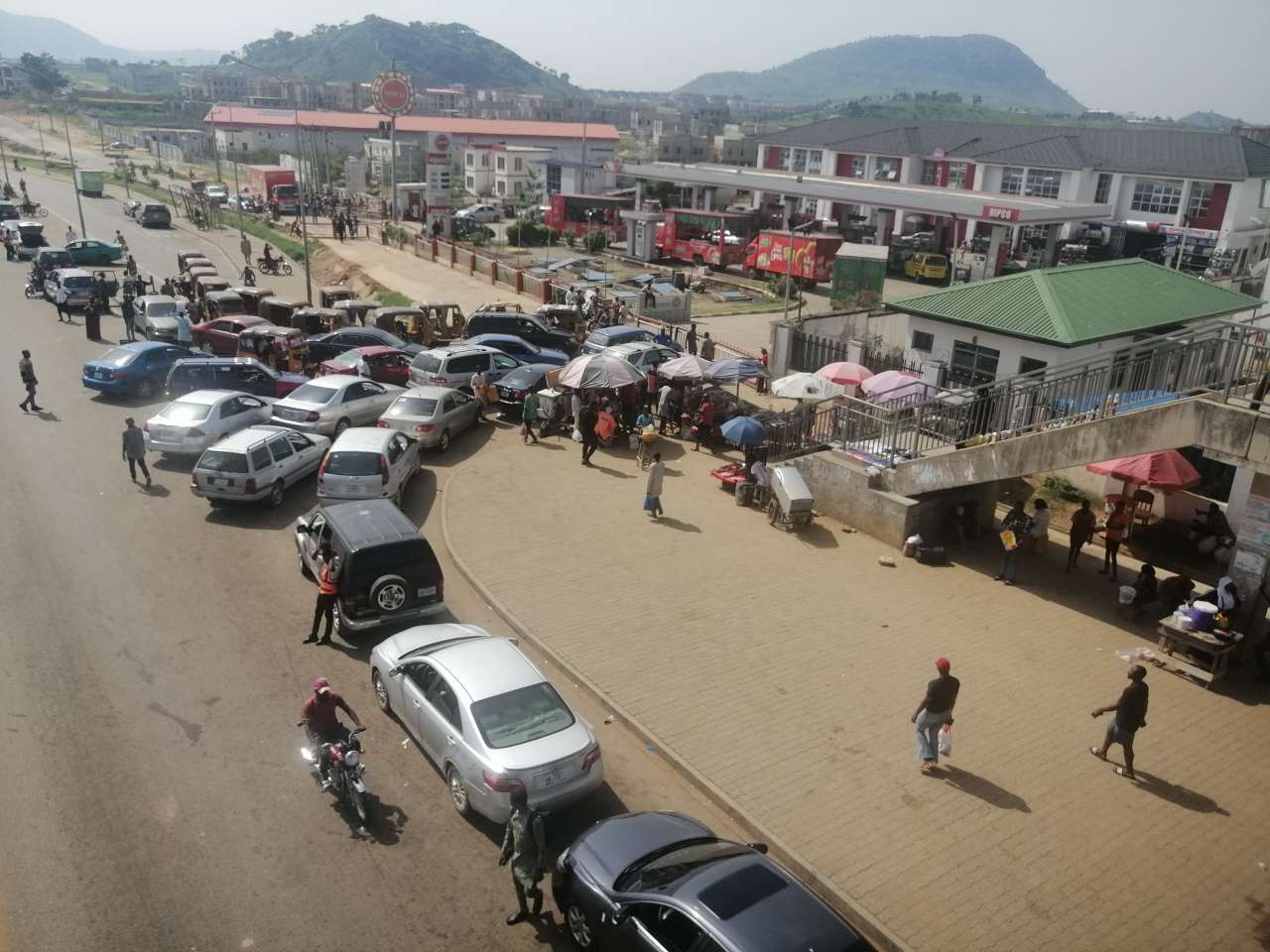 Consumers in long queues at NIPCO filling station in Kubwa.