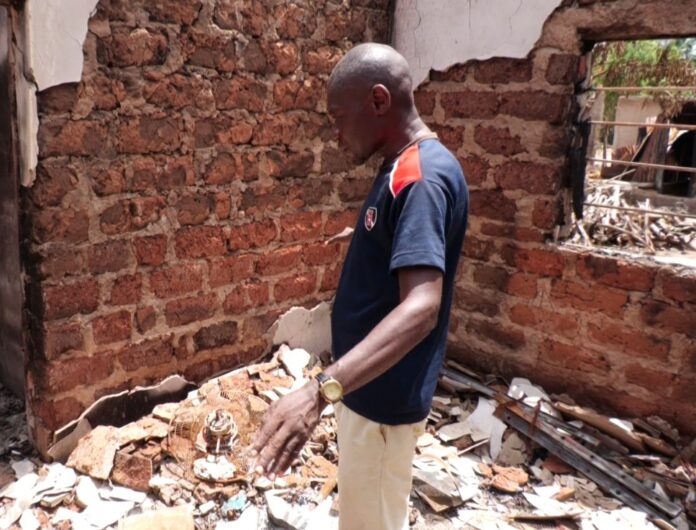 Joseph Obaike. inside the rubbles of his building Photo credit: Fatunbi Olayinka/The ICIR