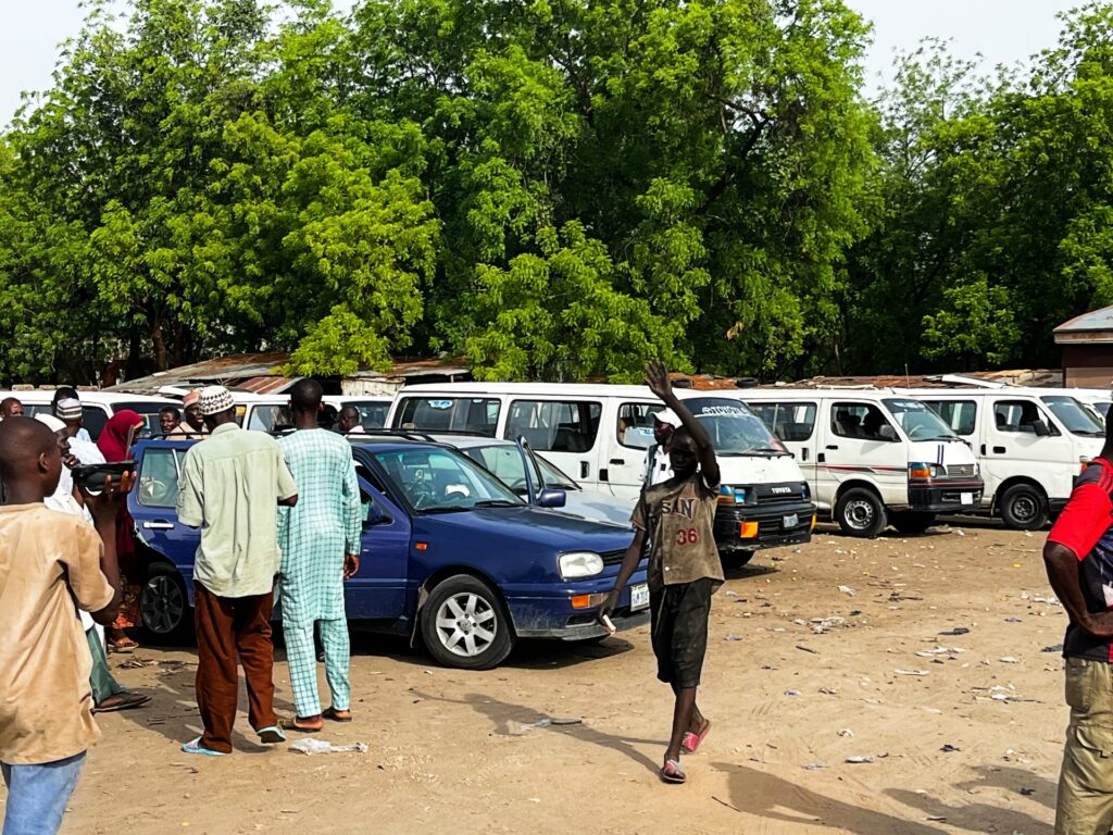 Drivers and passengers at the Bama Motor Park in Maiduguri, Nigeria. Photo: Ijasini Ijani/HumAngle.