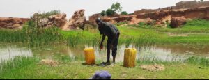 Water Vendor fetching dirty water for human consumption. PC: Lukman Abdulmalik