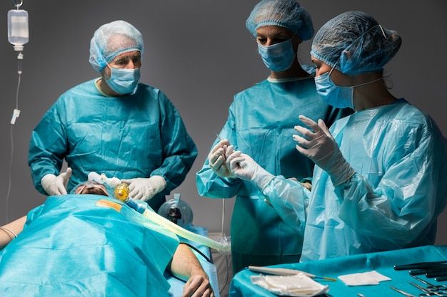 Free-Photo-_-Different-doctors-doing-a-surgical-procedure-on-a-patient.jpg