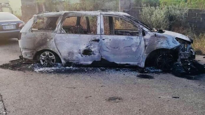 A burnt vehicle at the residence of INEC Resident Electoral Commissioner for Kogi state on December 1, 2023. PC: INEC