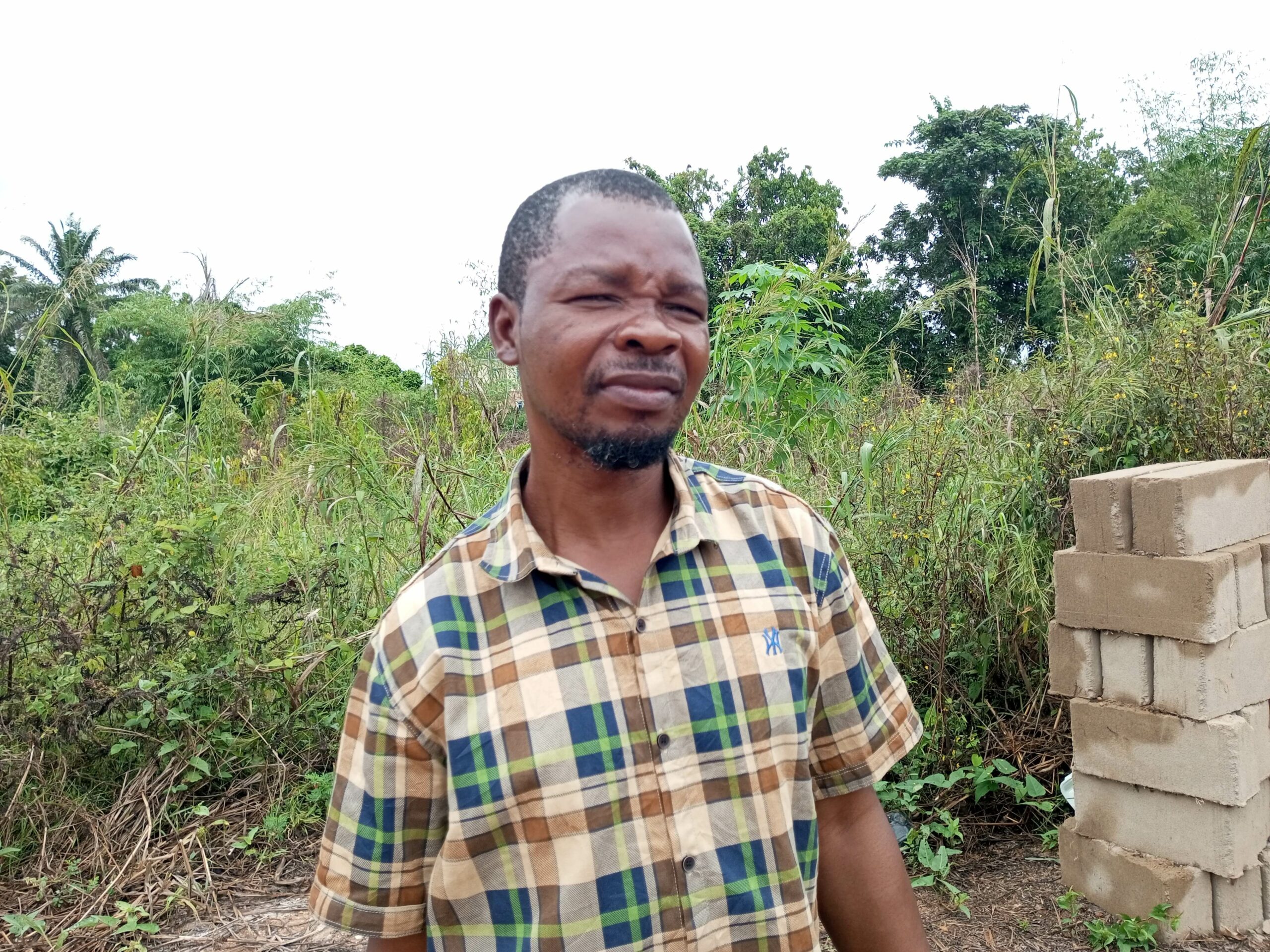 Felix from Umudora Anam is unhappy with the abandonment of the road project. Credit Alfred Ajayi