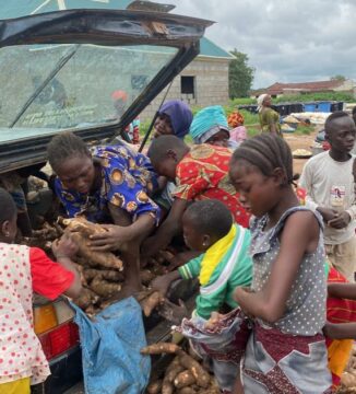 Children seen offloading cassava from a golf car. Photo: The ICIR