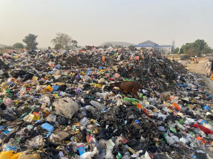 Dumpsite at Karu community close to the road after the garbage bin was removed.